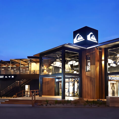 The bold exterior of Boardriders Torquay combines timber cladding and glass façades, offering glimpses of its surf-inspired interiors. The illuminated logo and Bar 61 deck highlight the store’s dual role as a flagship retail destination and community hub.