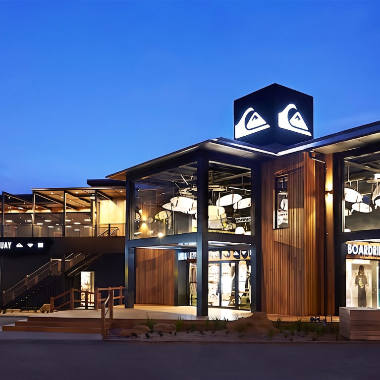 The bold exterior of Boardriders Torquay combines timber cladding and glass façades, offering glimpses of its surf-inspired interiors. The illuminated logo and Bar 61 deck highlight the store’s dual role as a flagship retail destination and community hub.