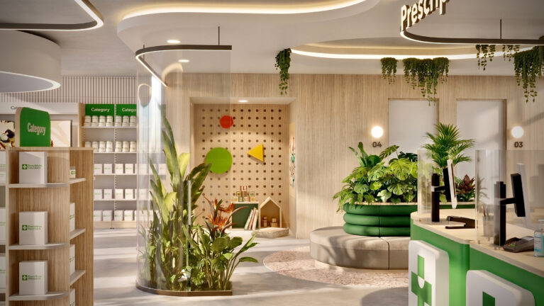 A calm waiting area with curved seating, lush planting, and a children’s play corner, positioned adjacent to the prescription counter to create a welcoming, family-oriented environment.