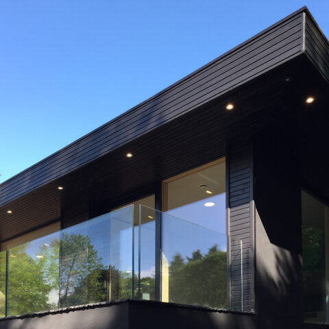 The terrace flows seamlessly from the interior spaces, offering a minimalist outdoor retreat surrounded by lush greenery. Clean lines, subtle furnishings, and natural materials emphasize Skyridge’s commitment to harmonious, eco-conscious design in its integration with the landscape.