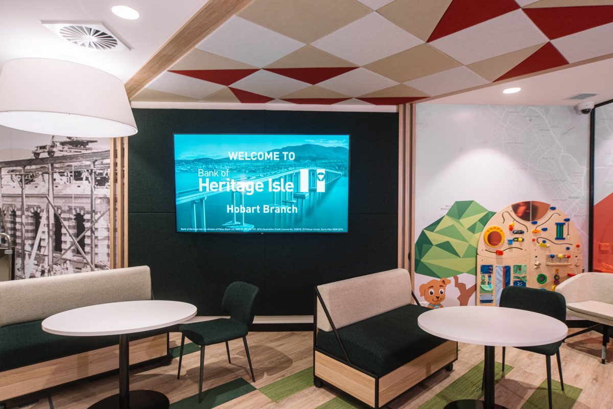 The welcoming entrance of Hobart Branch, featuring a prominent greeting display, comfortable seating, and a child-friendly play area.