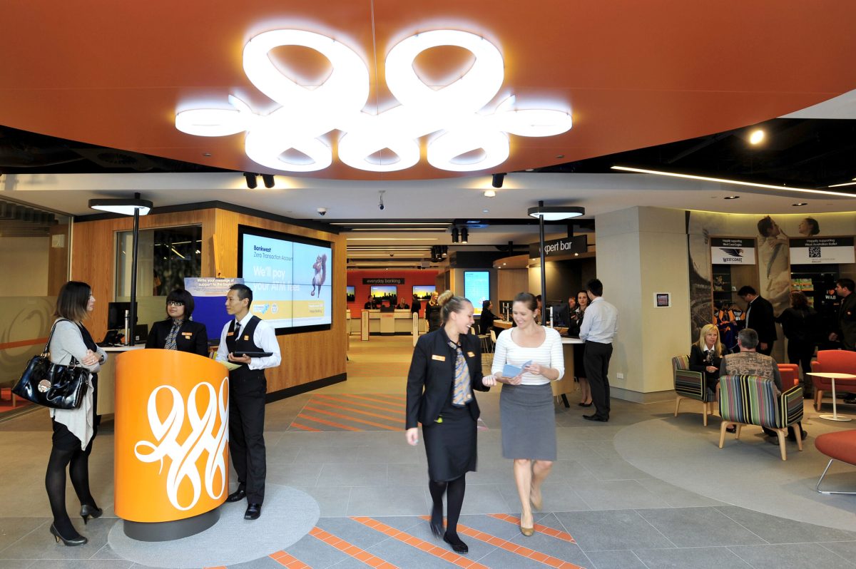 An interactive reception area featuring an illuminated ceiling installation and custom service plinths.