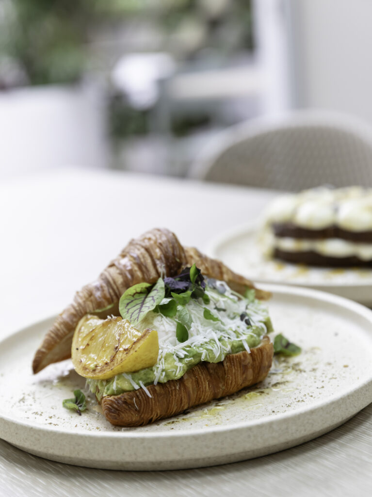 Sofia’s plating turns brunch into an art form. This croissant dish, served on neutral-toned ceramic plates, exemplifies the café’s commitment to quality and cohesive design.