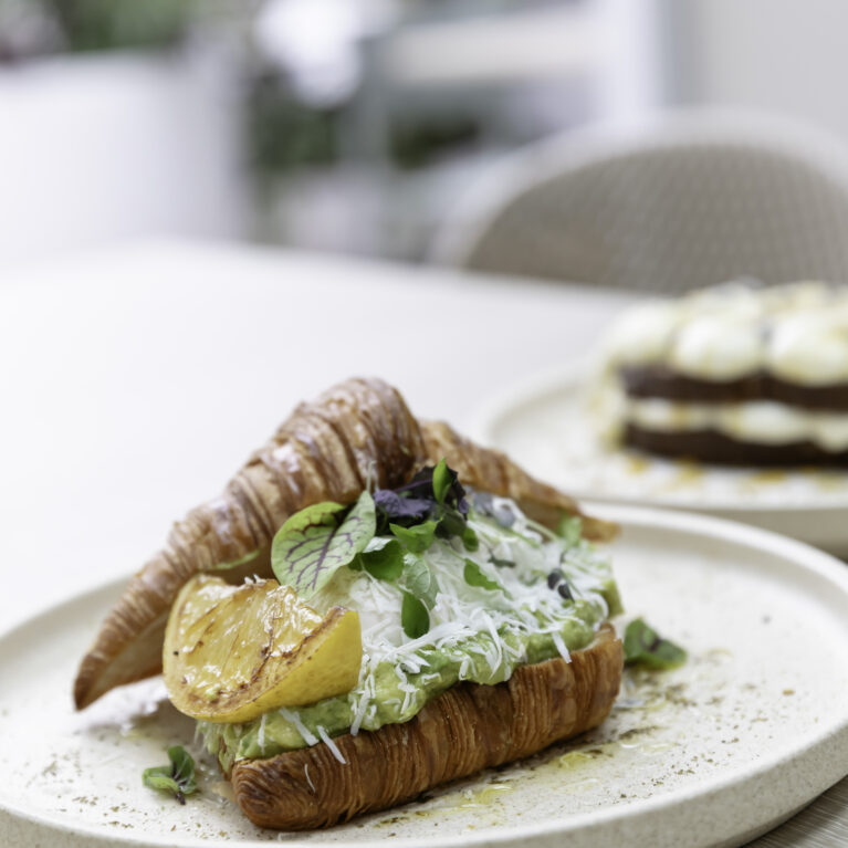 Sofia’s plating turns brunch into an art form. This croissant dish, served on neutral-toned ceramic plates, exemplifies the café’s commitment to quality and cohesive design.