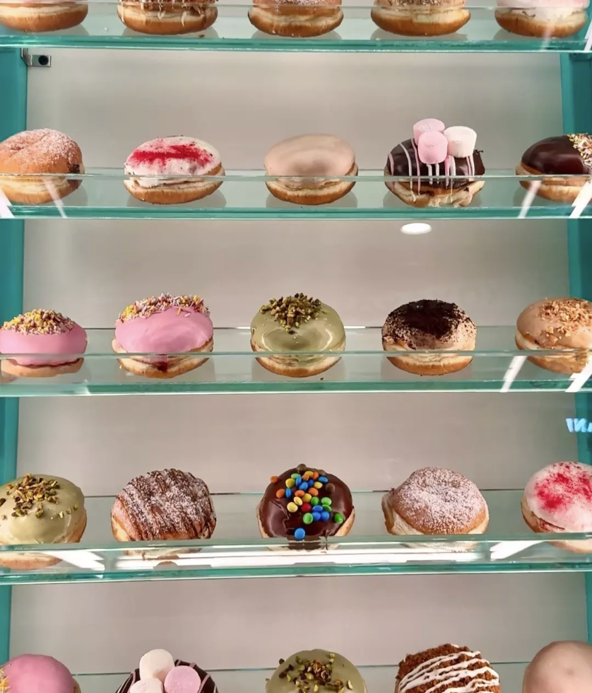 A quiet pause in the rush—a curated wall of sweet possibilities.
