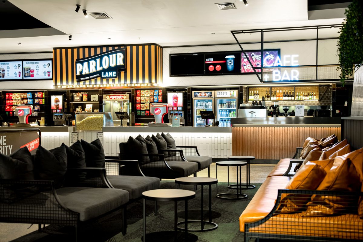 The cinema’s cafe and bar area, featuring comfortable seating and a stylish, modern concession counter.