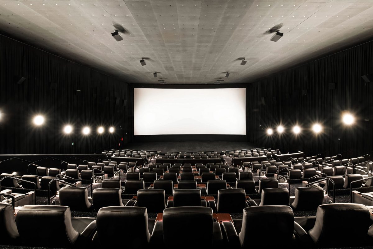 The Vmax cinema room, featuring spacious tiered seating and optimized lighting for an immersive viewing experience.