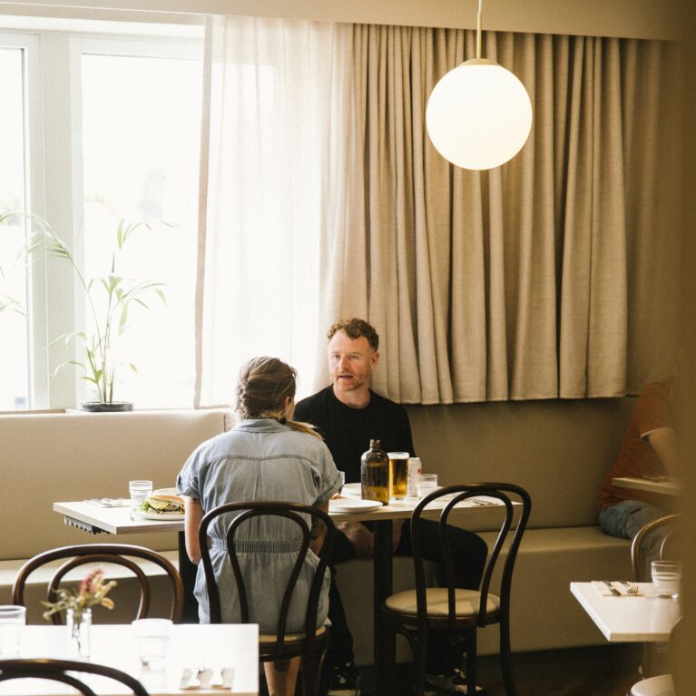 Tucked into a sunlit corner, this warm and understated space is made for lingering — a relaxed spot for catch-ups, quiet moments, or an easy midday meal.