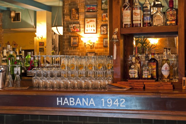 design clarity, cuban bar, bodeguita, habana, wooden bar, traditional back bar, brick wall, warm atmosphere