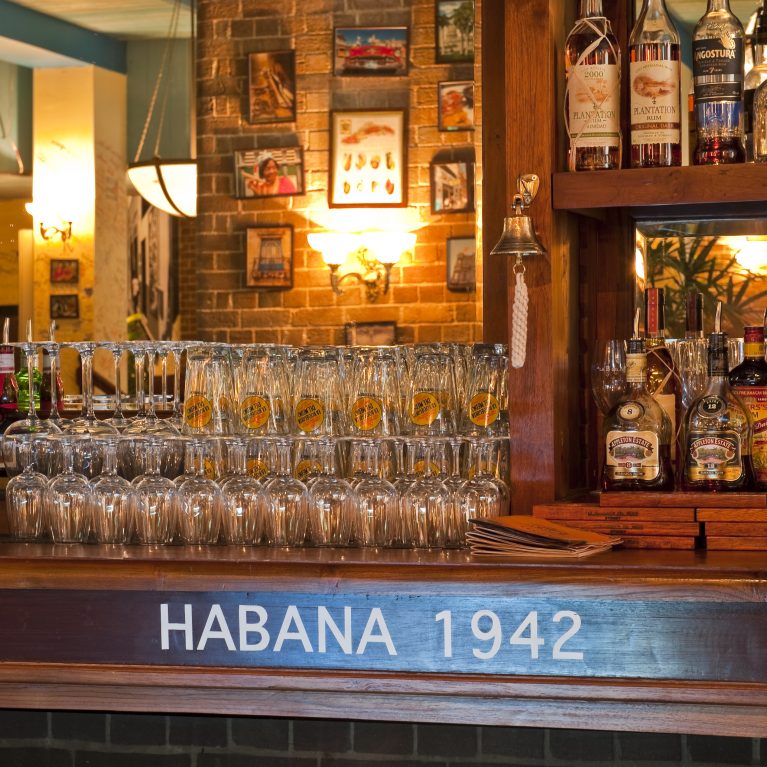design clarity, cuban bar, bodeguita, habana, wooden bar, traditional back bar, brick wall, warm atmosphere