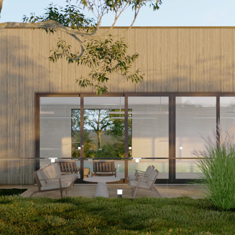 This courtyard view highlights the serene pool framed by floor-to-ceiling glass and surrounded by timber-framed outdoor seating. Lush landscaping and warm timber cladding enhance the harmony between architecture and nature, offering a relaxing and inviting environment.