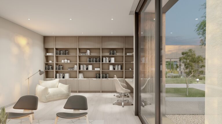 This library features built-in timber shelving, a cozy reading nook with a plush armchair, and sleek computer workstations. The open glass wall connects the interior to landscaped views, creating a tranquil yet functional space for study and relaxation.