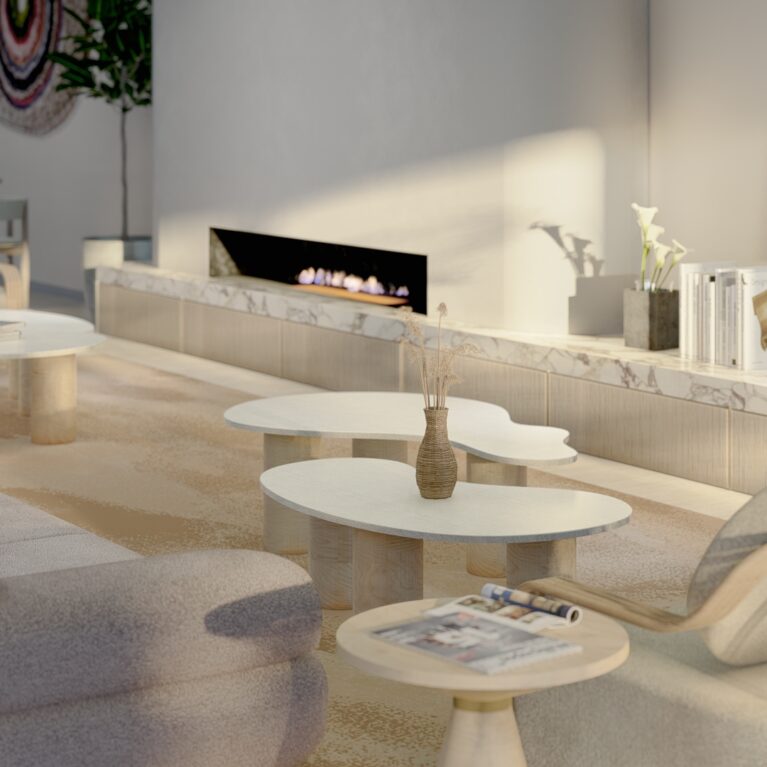 The living room lounge exudes sophistication with sculptural furniture, a soft neutral palette, and a Maximum Viola porcelain fireplace surround. Organic shapes and natural textures create a serene, inviting environment designed for relaxation and communal interaction.