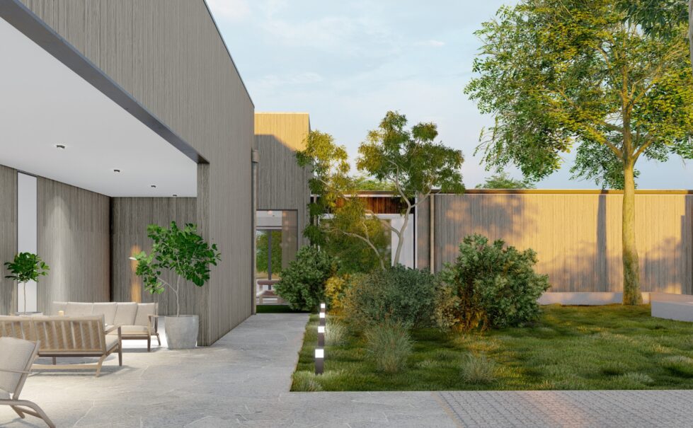 This tranquil courtyard connects the clubhouse and sanctuary, featuring lush landscaping, Torino Crazy Paving pathways, and an inviting outdoor lounge. Natural timber cladding and modern lighting enhance the connection between architecture and the surrounding coastal environment.