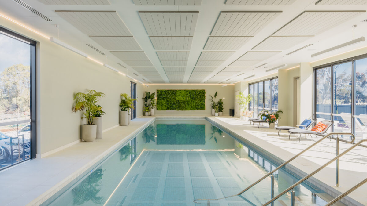 From the shallow end, the pool reads like a sunroom—quiet light, soft planting and long perspectives that make daily laps feel like a ritual rather than a routine.