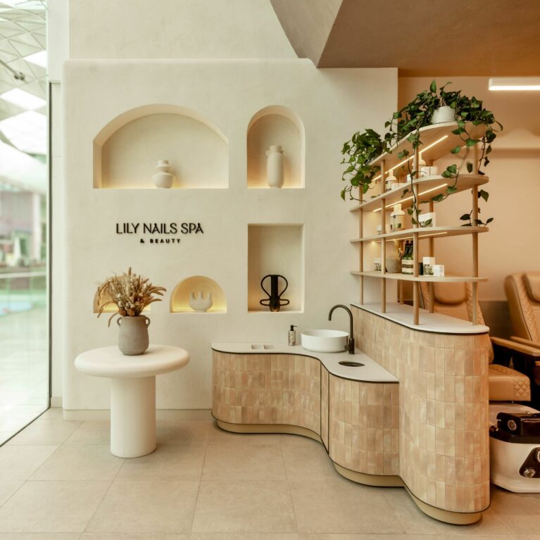 The entrance sets a calming tone with softly sculpted niches, curated décor, and warm ambient lighting, introducing guests to a serene and thoughtfully designed environment.