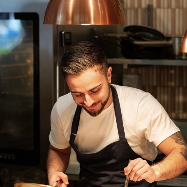 At Margot Osteria, the open kitchen becomes a focal point of the dining journey, where guests are invited to watch the chefs at work—a subtle yet engaging touchpoint that adds authenticity and connection.