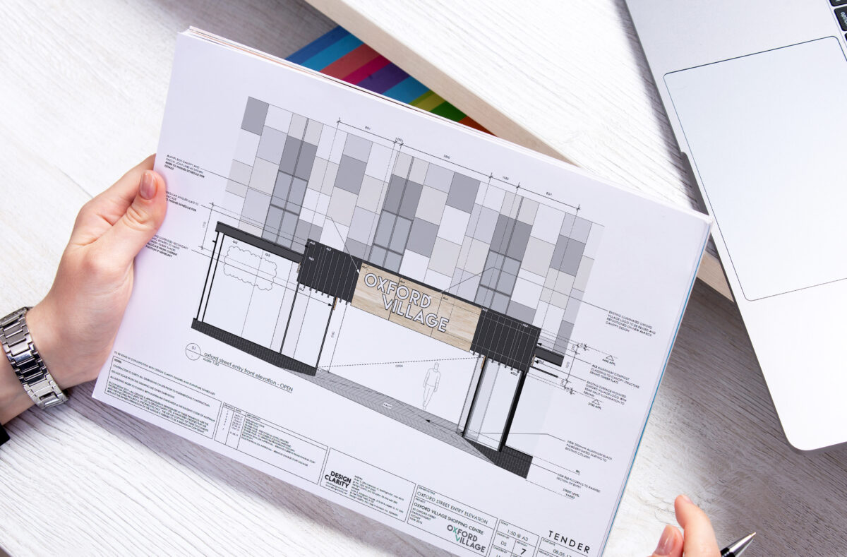 RDM oversight translating brand intent into compliant, buildable external signage for Oxford Village.