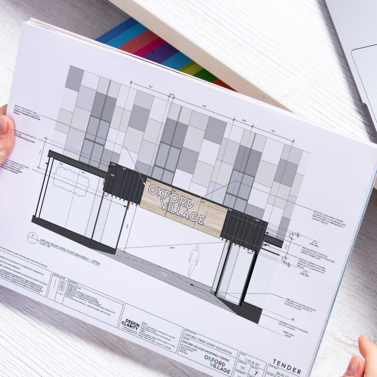 RDM oversight translating brand intent into compliant, buildable external signage for Oxford Village.
