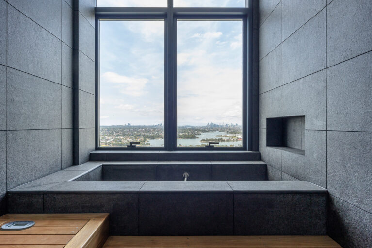 A custom-designed bath with expansive views, blending luxury finishes and serene scenery for a truly relaxing experience.