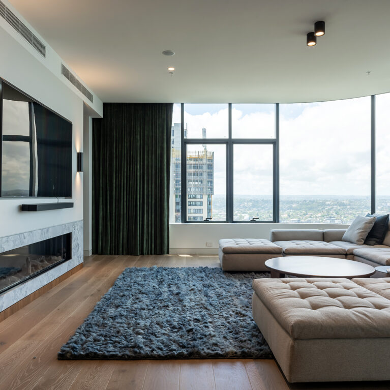 A cozy living area with panoramic views, featuring premium furniture and textured finishes.