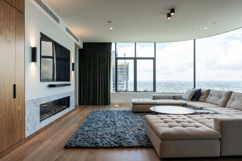 A cozy living area with panoramic views, featuring premium furniture and textured finishes.