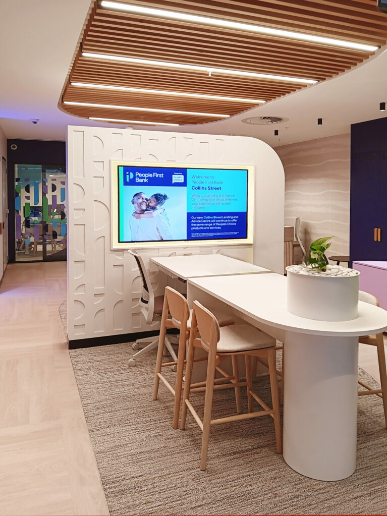 The consultation bar near the entrance, featuring a modern curved counter and inviting seating.