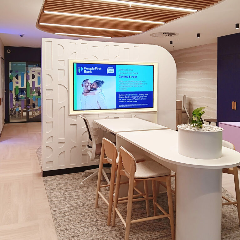 The consultation bar near the entrance, featuring a modern curved counter and inviting seating.