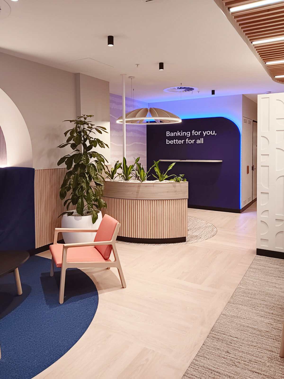 The mission statement wall in brand colour 'ribbon blue' is halo illuminated so visible day and night