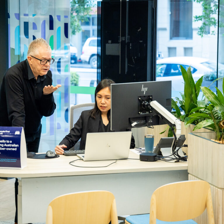 An inviting consultation desk blends functionality with greenery, fostering open and welcoming conversations.