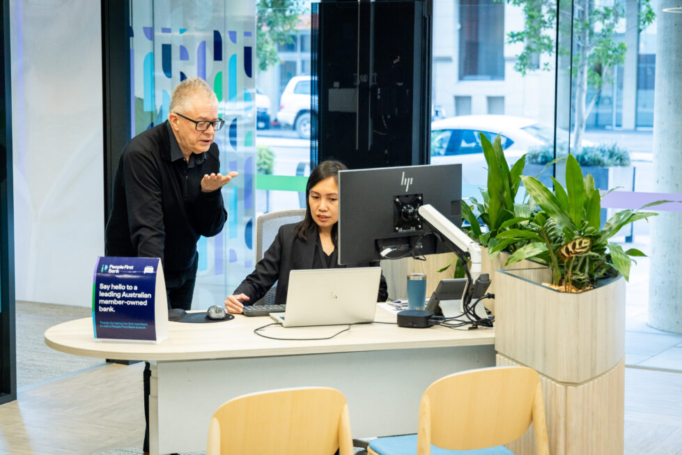 An inviting consultation desk blends functionality with greenery, fostering open and welcoming conversations.