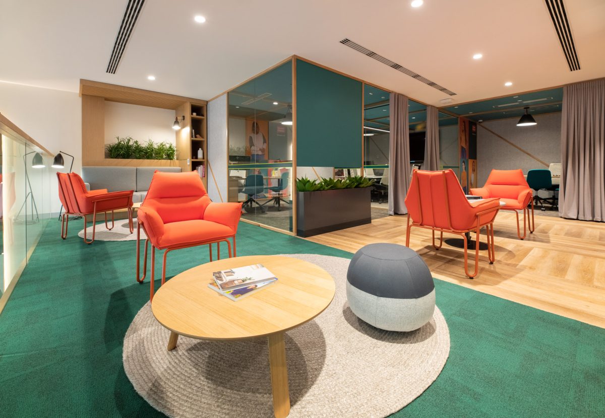 Semi-private consultation space on the upper floor. The overall impression is of a modern, comfortable, and well-designed work space designed for collaborative or relaxation purposes.