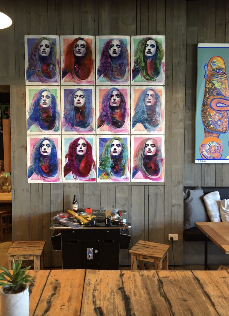 This artistic installation highlights the creative energy of the store, blending surf culture with bold artistic expression. The vibrant portraits and eclectic styling enhance the relaxed atmosphere, inviting visitors to immerse themselves in a unique cultural experience.