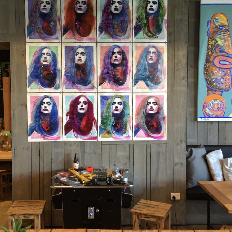 This artistic installation highlights the creative energy of the store, blending surf culture with bold artistic expression. The vibrant portraits and eclectic styling enhance the relaxed atmosphere, inviting visitors to immerse themselves in a unique cultural experience.