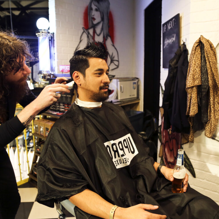 The in-store barber service adds a unique touch, offering grooming in a relaxed environment. Industrial decor, custom graffiti, and personalized service combine to create a vibrant space where customers can unwind while staying connected to the surf culture vibe.