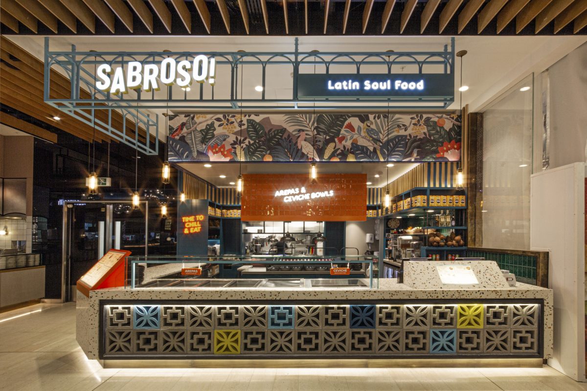A horizontal service layout featuring patterned breezeblock detailing and industrial signage.