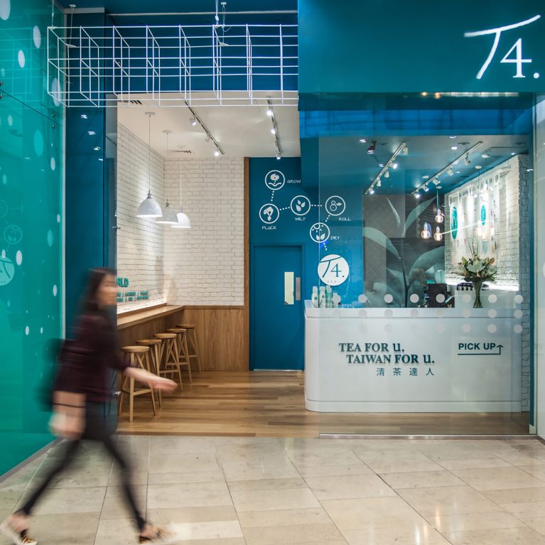 design clarity, shopfront design, tea store, soft drinks, metal canopy, turquoise paint, welcoming entrance, exposed lighting