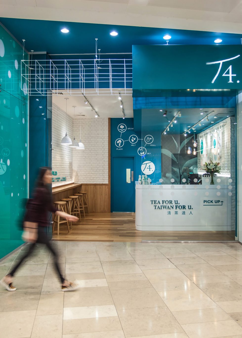 design clarity, shopfront design, tea store, soft drinks, metal canopy, turquoise paint, welcoming entrance, exposed lighting