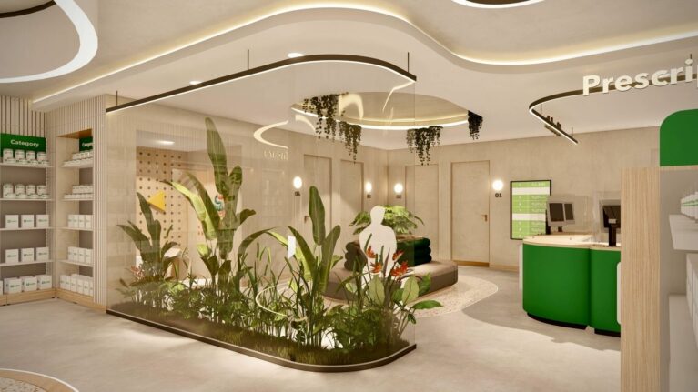 A softly illuminated prescription lounge framed by a glass “greenhouse” planter and organic ceiling lights, offering a tranquil space for customers awaiting consultation or collection.