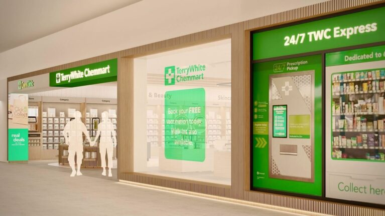 A clear exterior view of the TerryWhite Chemmart store, highlighting its glass façade, illuminated signage, and integrated 24/7 TWC Express prescription pickup kiosk for round-the-clock service.