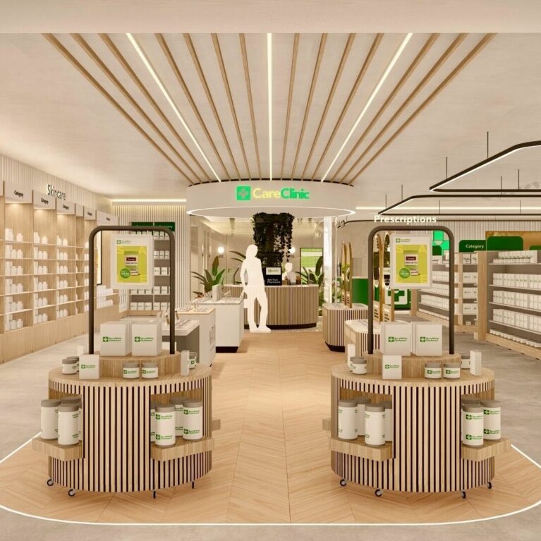 A spacious view of the store’s central hub, guiding customers towards the Care Clinic while showcasing refill stations, category signage, and a clean, natural materials palette designed for clarity and ease of navigation.