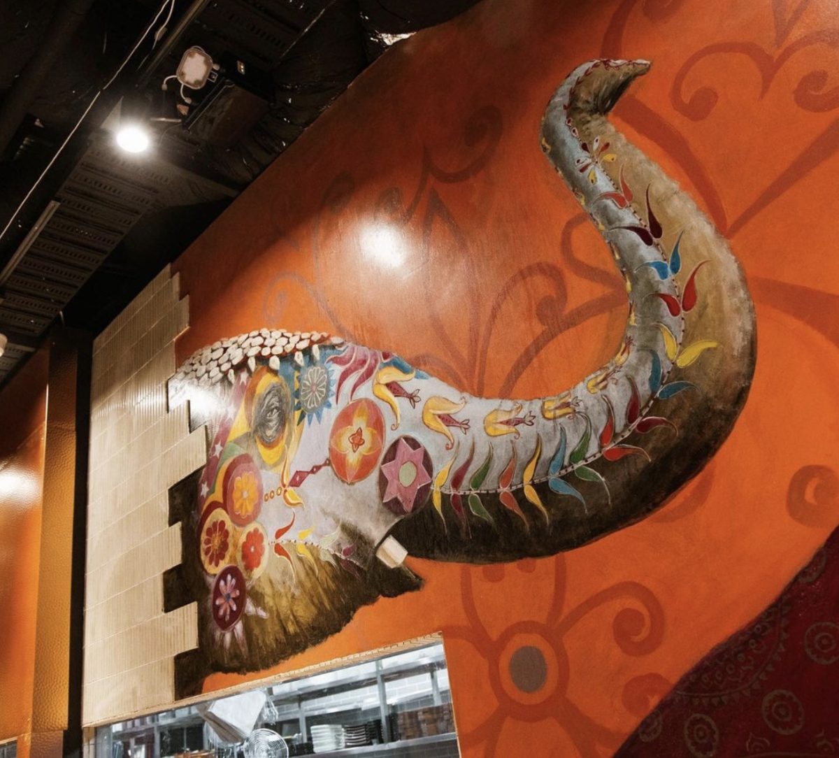 A close-up of the colorful elephant mural at the Massala Bar, showcasing intricate designs and vibrant hues that add cultural richness to the space.