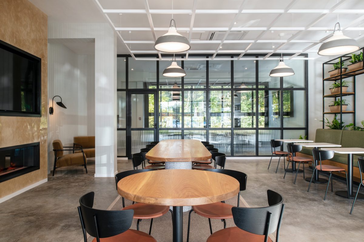 The meeting area at The Mason’s Yard, a bright, open-plan space with warm textures, natural light, and casual seating for collaboration.