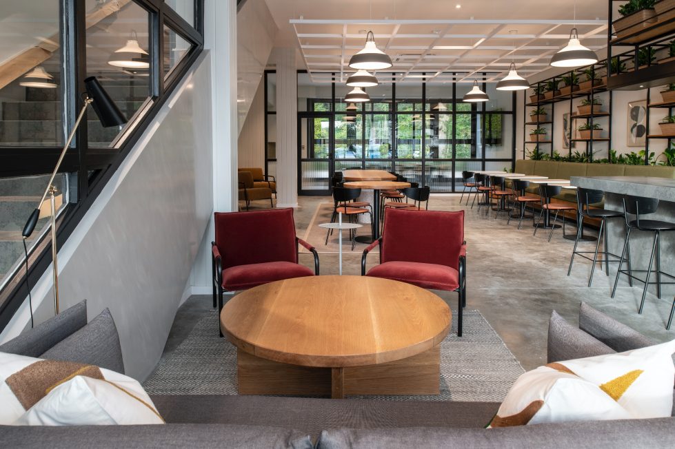 The customer lounge at The Mason’s Yard, a modern, open-plan area with a relaxed seating, warm & neutral tones and natural light.