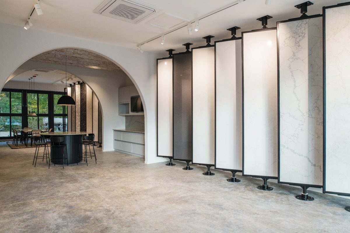 Inside the Gemini Worktops showroom, rotating panels display an array of high-quality quartz products in a contemporary, well-lit space.