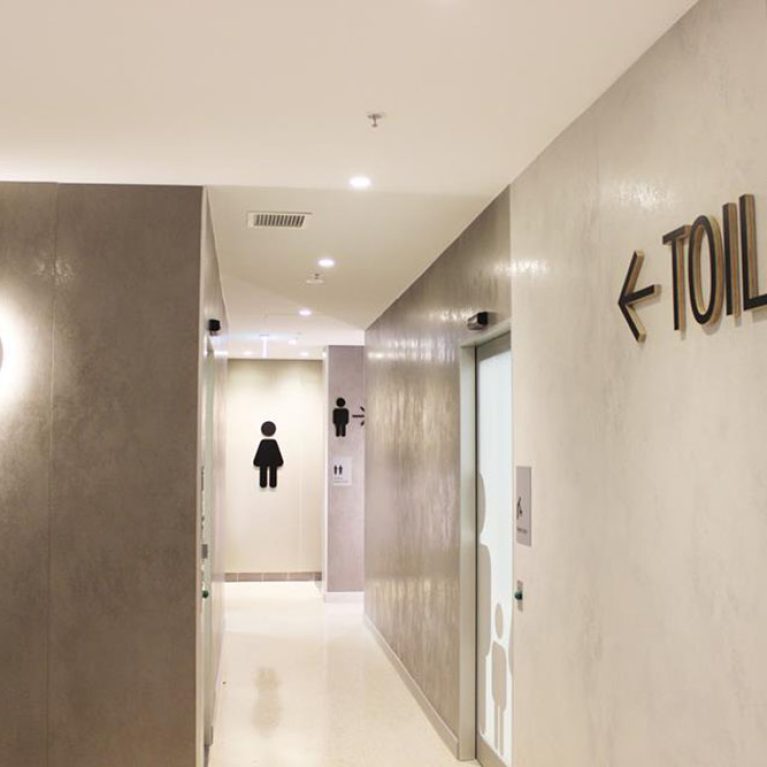 design clarity, toilet interior design, concrete walls, moroccan style plastered wall, signage design, toilet sign