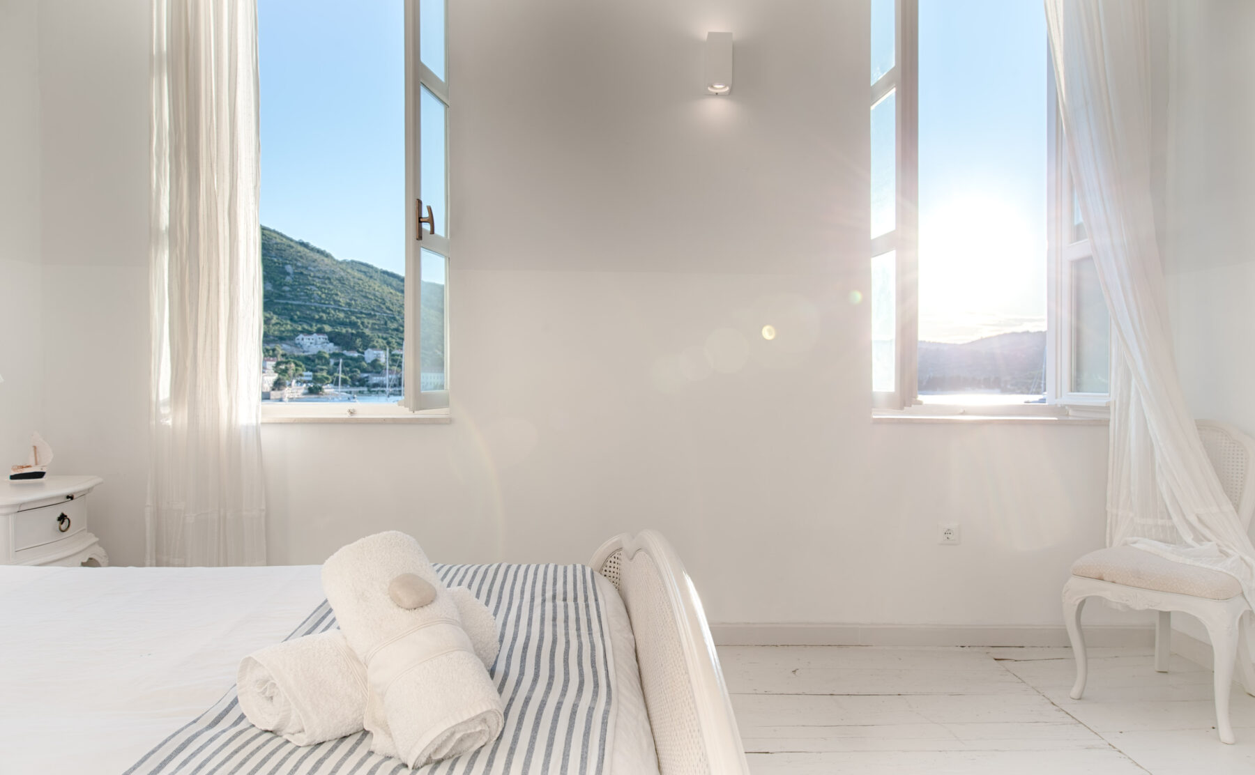 A calm, light-filled guest suite overlooking the Adriatic coastline.