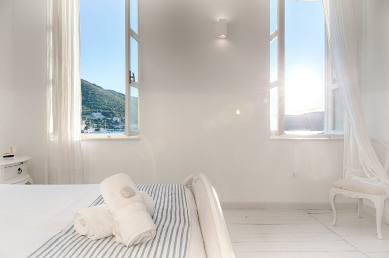 A calm, light-filled guest suite overlooking the Adriatic coastline.