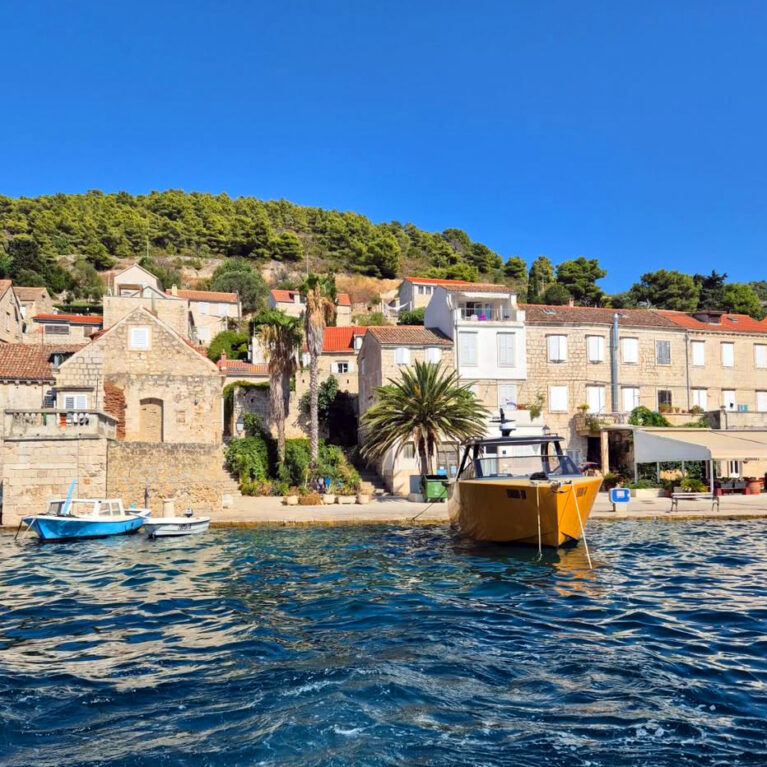 Villa Riva’s picturesque waterfront location is framed by charming stone buildings and lush greenery. Its pristine facade and vibrant surroundings offer a perfect blend of historic architecture and Mediterranean allure.