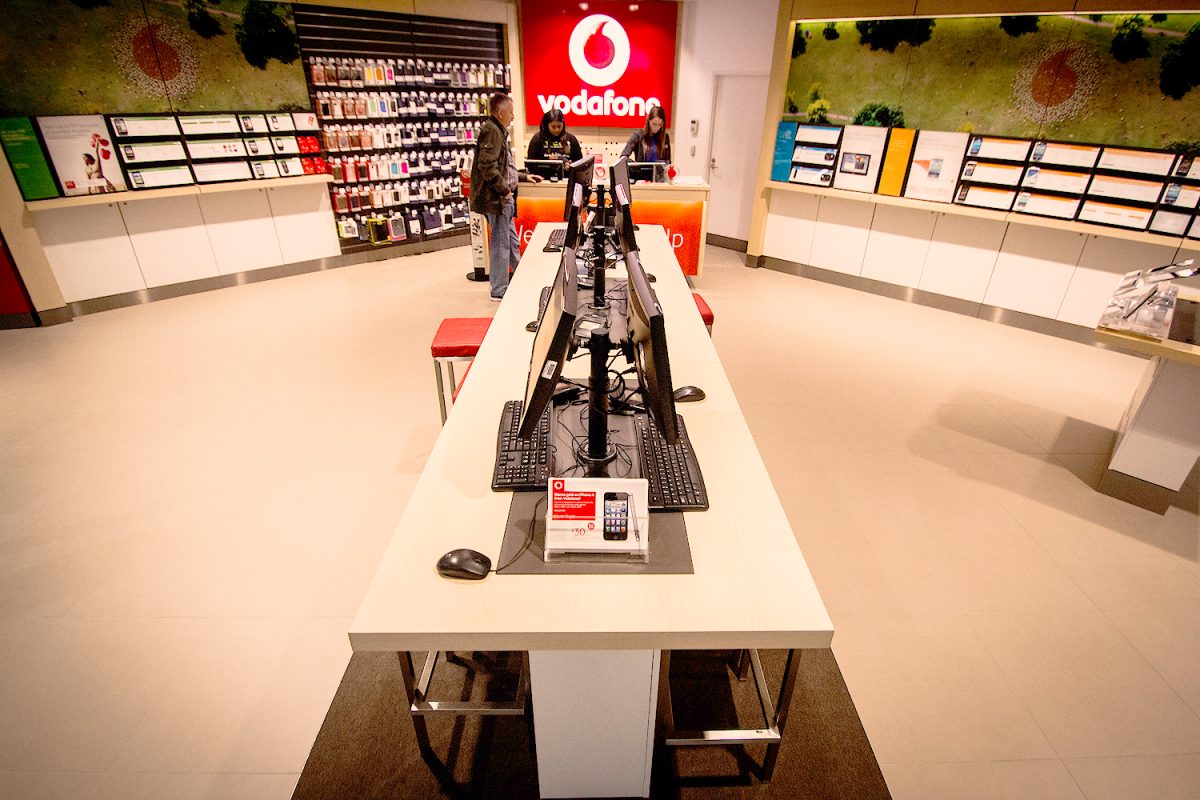 The Vodafone store’s self-service desk with organized workstations and a streamlined design for convenient customer use.